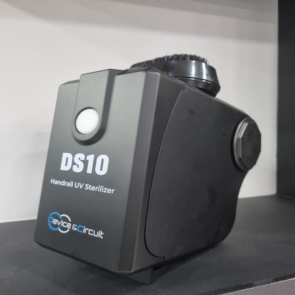 Escalator handrail UV sterilizer